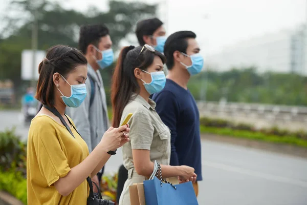 depositphotos_144051461-stock-photo-men-and-women-on-roadside
